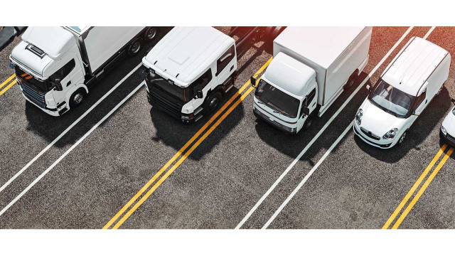 trucks of various sizes on the road. 3d render and illustration.